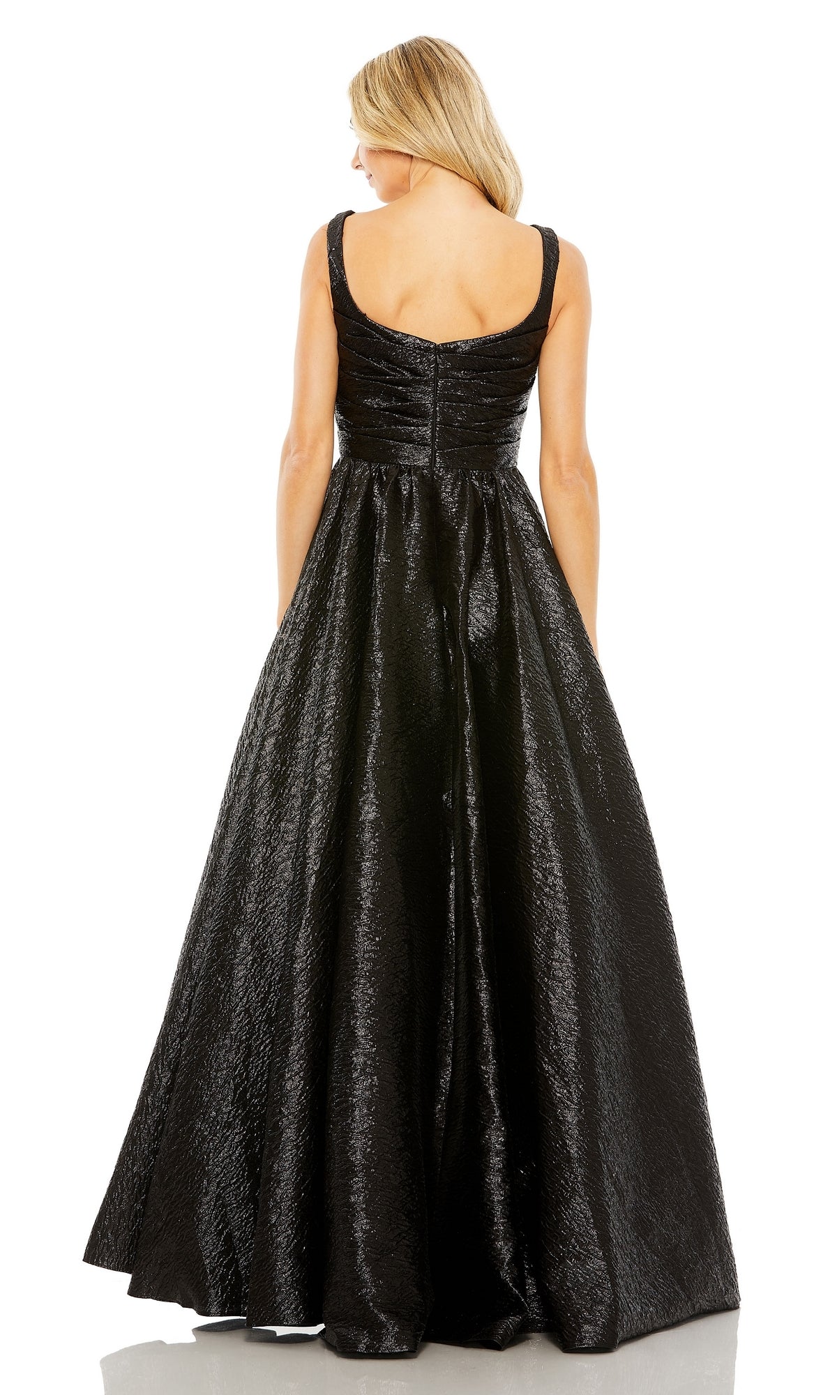 A woman with blonde hair models the Long Glitter Prom Ball Gown (Mac Duggal 68349), a sleeveless, floor-length black dress, shown from the back against a plain white background.